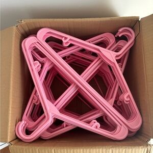 Box of Pink Plastic Hangers (Around 100, Used)